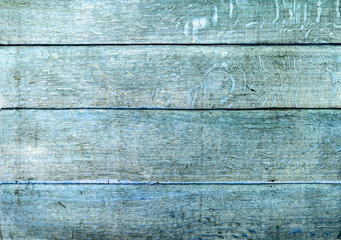 The old wide ugly shabby endured structure. Ancient horizontal wooden rough simple background. Blue wood.