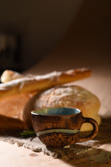 Bakery products with floured bread, loaf, baguette and a cup