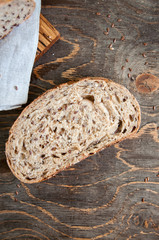 Fototapeta na wymiar Freshly baked sourdough organic bread with flax seeds