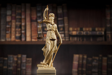Fototapeta premium Antique statue of justice, law, books background
