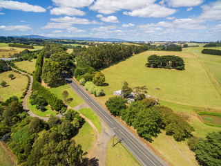 Rural road in Australian countryside on bright summer day