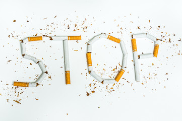 Stop smoking word written with broken cigarettes