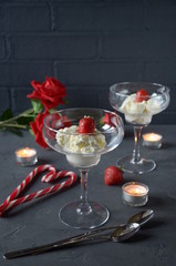 vanilla ice cream with candy cane heart in glass cups.  valentine's day decoration
