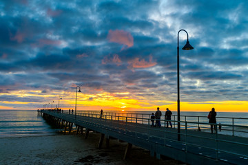 People walking on pier