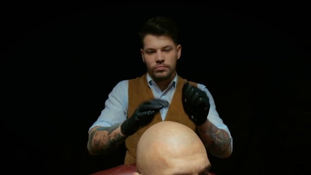 Close-up Of A Using Clippers To Shave Head.