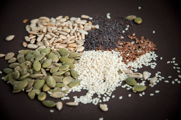 Variety of seeds over dark background