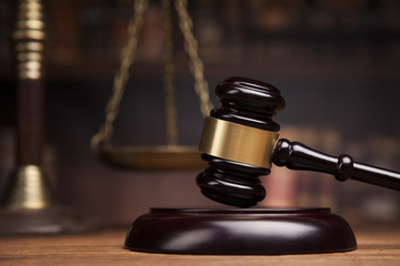 law theme, mallet of the judge, justice scale, books, wooden des