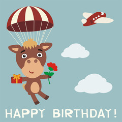Happy birthday! Funny camel flying on parachute with gift and flower. Birthday card with camel in cartoon style.