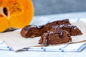 Pumpkin vegan brownie with a chocolate. Love for a healthy desserts concept.