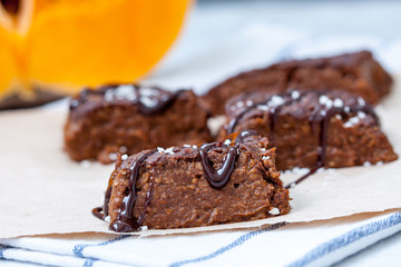 Pumpkin vegan brownie with a chocolate. Love for a healthy desserts concept.