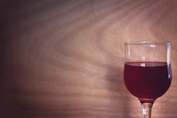Wine glass on wood background