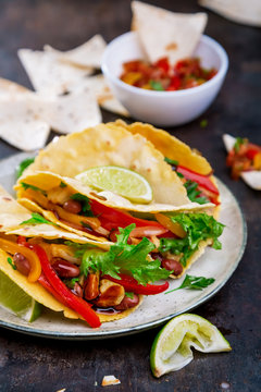 Tacos. Mexican yellow corn tortilla with chicken and vegetables