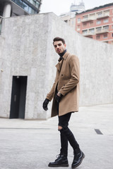 Beautiful young man posing in an urban context