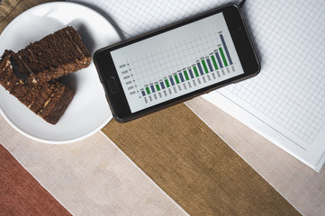 Graph on a smartphone, wallet.