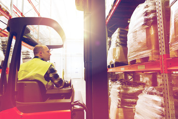 man operating forklift loader at warehouse