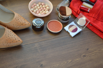 women's accessories. Women's cosmetics: lipstick, powder, eye shadow, cream, powder and brush. Concept of femininity and beauty