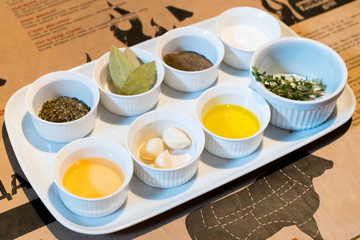 Close up Various Condiments and herbs and oils on Containers