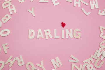 Sorting letters Darling on pink.