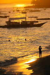 Traveler Taking a Photo of Alona Beach - Panglao, Philippines