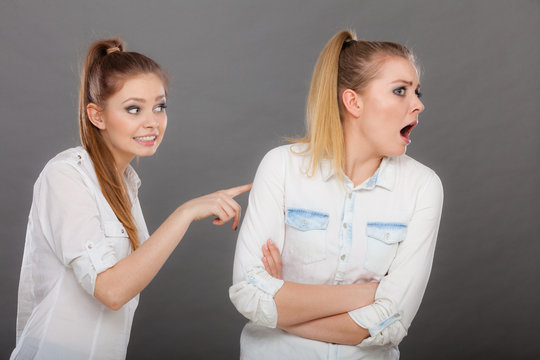 Two girls having argument, interpersonal conflict
