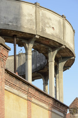 thin pillars of water tank, Crespi on Adda
