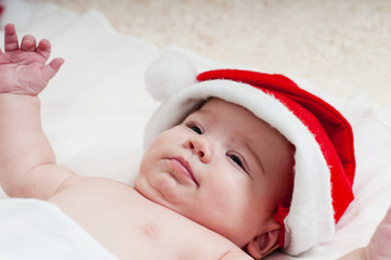 Cute little newborn santa baby