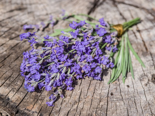 Bunch of lavandula or lavender flowers on the old wooden table.