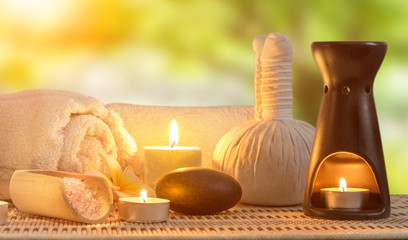 spa burning candles and zen stone