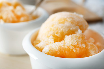 White cup with color ice dessert, closeup