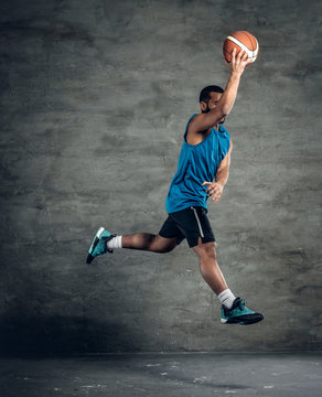Jumping black man basketball player.