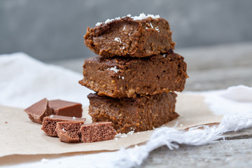 Chocolate pumpkin brownies with slices of chocolate and syrup. Love for a healthy desserts concept.