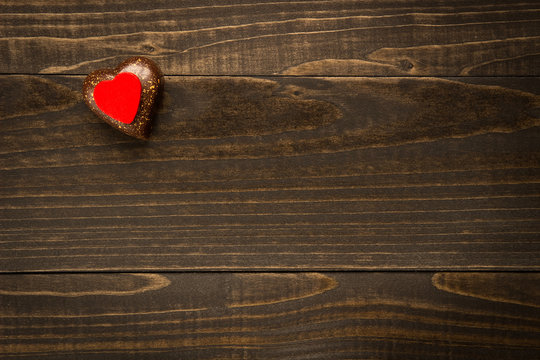 Valentine's Day heart on the wooden texture background with copy