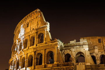 Fototapeta premium ITALY-ROME, 9 September 2010: Projector lights olympic pictures on Colosseo, Lazio region.