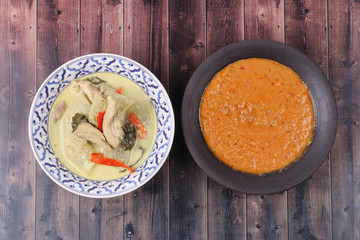 Green chicken curry and fish curry in coconut milk .