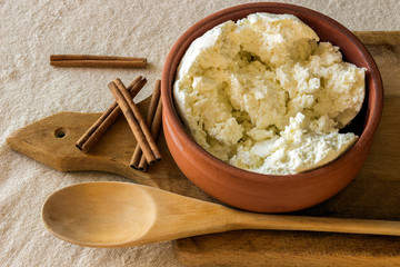 Fresh cottage cheese in a ceramic bowl.