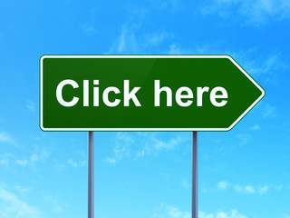 Web development concept: Click Here on road sign background