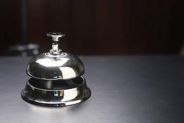 bell and the key at the reception in the hotel