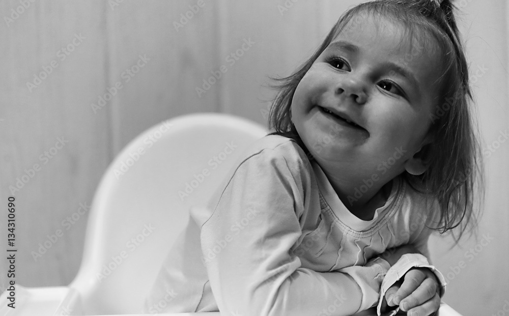 Wall mural black and white photo of kid smiling and have fun white backgro