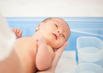 Newborn baby first bath