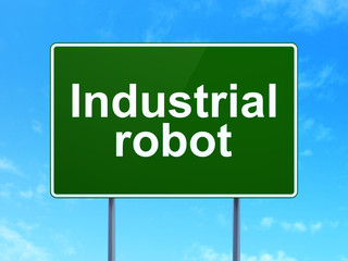 Manufacuring concept: Industrial Robot on road sign background