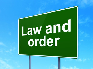 Law concept: Law And Order on road sign background