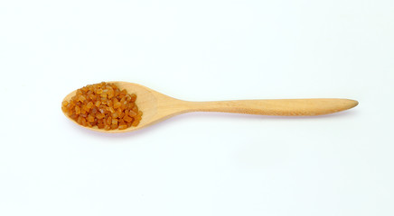 Brown caramelized sugar in a spoon