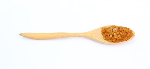 Brown caramelized sugar in a spoon