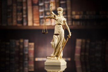 Fototapeta premium Antique statue of justice, law, books background