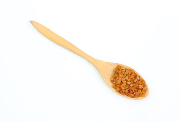 Brown caramelized sugar in a spoon