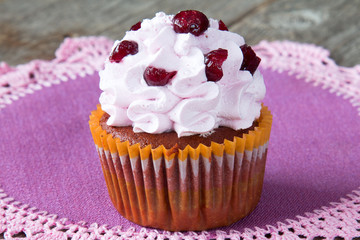Cupcake on a lacy napkin close-up