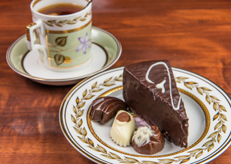 candies cake and cup of tea