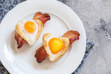 Baked egg breakfast with bacon heart shape for Valentine day