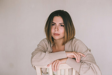 Naklejka premium Portrait of beautiful and sexy young woman.Portrait of a normal girl looking camera. Beautiful woman portrait over brown background.