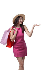 Smiling asian girl wearing hat holding shopping bag